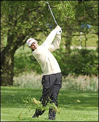 Ireland's Padraig Harrington plays out of the semi-rough during the start of his final round