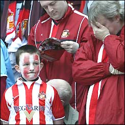 Sunderland fans looks despondent before their team's final game in the Premiership
