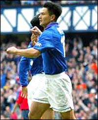 Michael Mols celebrates his goal for Rangers