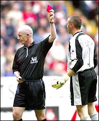 Referee Dermot Gallagher shows Charlton keeper Dean Kiely the red card after a clash with Louis Saha
