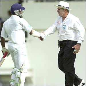 Sri Lankan opener Sanath Jayasuriya apologises to the umpire after hitting him with a shot