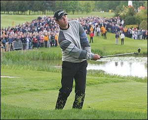 Paul Casey chips onto the 18th green on the way to a four-shot victory