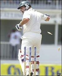 Darren Lehmann looks back to see his wicket fall off Merv Dillon's bowling