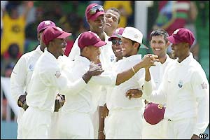Carlton Baugh celebrates the wicket of Hayden with team-mates