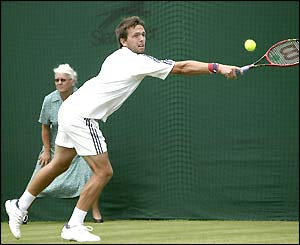 Lee Childs stretches for a return against Rafael Nadal-Parera