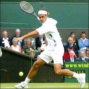 Roger Federer plays a forehand