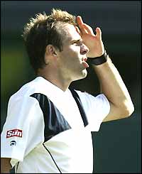 Greg Rusedski reacts furiously to a controversial line call