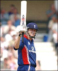 Andrew Flintoff salutes the crowd after scoring his fifty