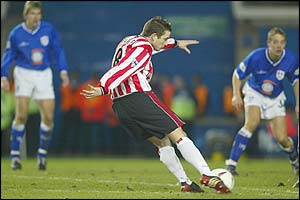 Southampton's Matt Oakley fires a shot towards the Millwall net in the side's FA Cup replay