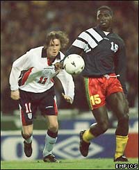 Mark-Vivien Foe gets the better of Steve McManaman in a friendly match in 1997