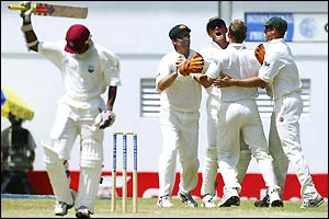 Shivnarine Chanderpaul leaves the pitch after being dismissed by Brett Lee