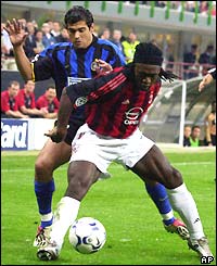 Sergio Conceicao of Inter tussles with AC Milan's Clarence Seedorf