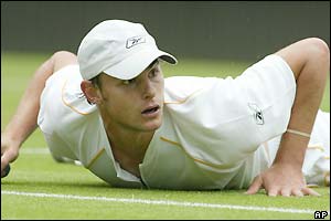 Andy Roddick suffers a slip on Centre Court