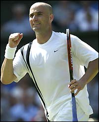 Andre Agassi celebrates beating Younes El Aynaoui in the third round at Wimbledon
