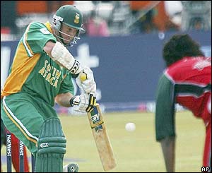 South Africa's captain Graeme Smith hits a ball from Zimbabwe's Douglas Hondo
