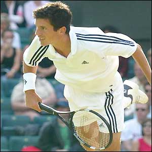 Tim Henman serves