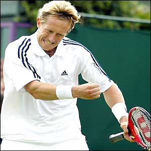 Jonas Bjorkmann punches the air after winning a point