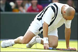 Andre Agassi is floored during his match with Mark Philippoussis