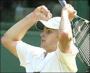 Andy Roddick raises his arms in victory
