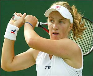 Svetlana Kuznetsova watches the ball after hitting a backhand