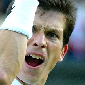 Tim Henman roars as he hits a winner