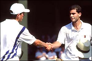 Tim Henman and Pete Sampras shake hands over the net after their second round match in 1995