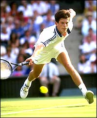 Tim Henman stretches for a shot against Yevgeny Kafelnikov in 1996