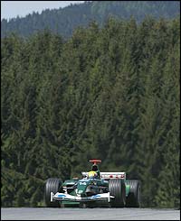Australian Mark Webber powers the Jaguar down the straight