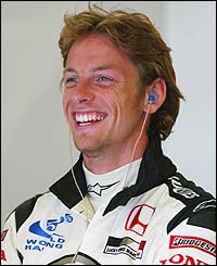 Jenson Button is in relaxed mood in the pits during qualifying