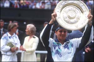 Conchita Martinez holds the trophy aloft after her 1994 victory