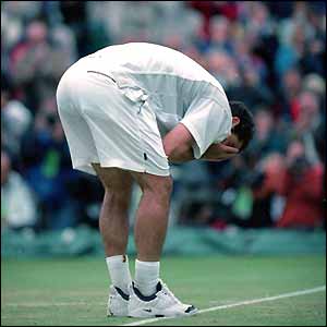 Pete Sampras celebrates his record-breaking 13th Grand Slam title at Wimbledon in 2000 