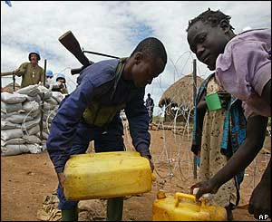 A Congolese policeman distributes water at Bunia airport