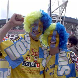 Two fans appear in good spirits ahead of the match