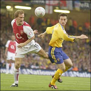Arsenal's Ray Parlour and Southampton's Matt Oakley challenge for the ball