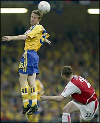 Southampton's Brett Ormerod leaps above Oleg Luzhny