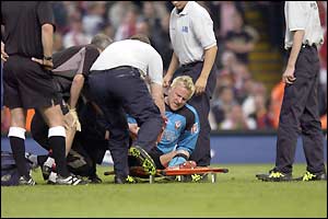 Saints keeper Antti Niemi is stretchered off