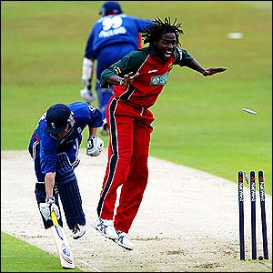 Zimbabwe's Douglas Hondo celebrates as England's Chris Read is run out 