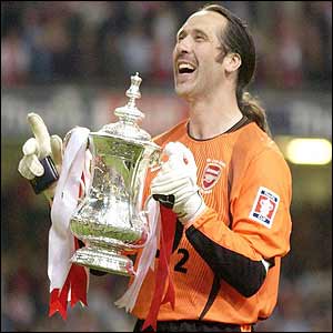 Arsenal's stand-in captain David Seaman lifts the FA Cup