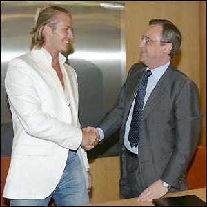 David Beckham shakes hands with Real Madrid president Florentino Perez
