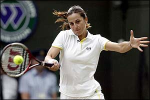 Silvia Farina Elia takes the first set in her match with Kim Clijsters 7-5