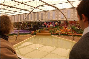 Two visitors look at the Gateshead Metropolitan Borough Council exhibit at the Chelsea Flower Show,
