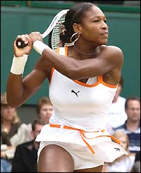 Serena Williams winds up for a two-handed backhand