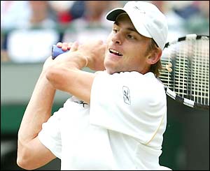 Andy Roddick hits a booming backhand