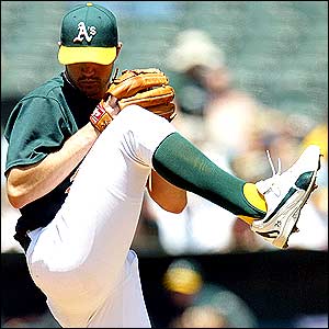 Barry Zito of the Oakland Athletics pitches against the Seattle Mariners in the second inning at the Network Associates Coliseum in Oakland, California