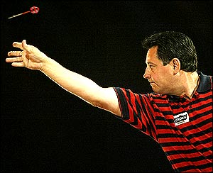 Dennis Priestly throws a dart during the Las Vegas Desert Classic II Darts competition