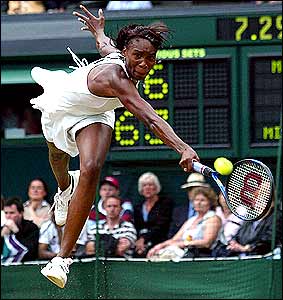 Venus Williams dives for a backhand during her victory over Kim Clijsters of Belgium in the women's semi-finals 
