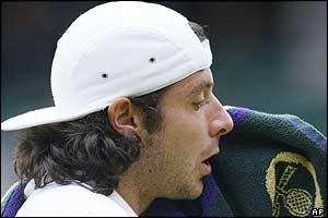 Grosjean reacts as he loses the eighth game of the third set after a double fault