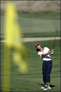 13-year-old Michelle Wie aims for the pin on the third green at Pumpkin Ridge Golf Club during the second round of the US Open