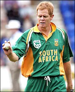 Shaun Pollock walks back to his bowling mark