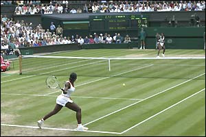 Serena Williams gets ready to play a forehand back to her sister Venus